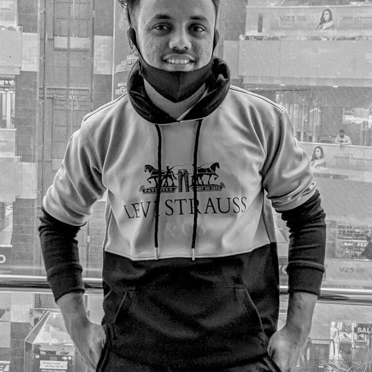 Kaveri Mehta, Lead Design Curator at Jet Stream Works, reviewing corporate floral arrangements